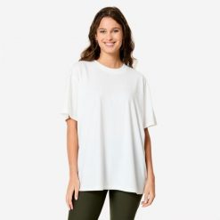 Koszulka damska Domyos Gym & Pilates 520 oversize. Białe bluzki damskie DOMYOS, xl, bez wzorów, z bawełny, sportowe, bez kołnierzyka, bez ramiączek. Za 59.99 zł.