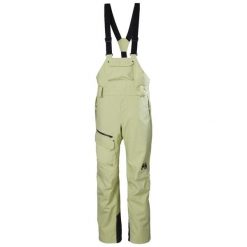 Damski kombinezon narciarski Helly Hansen. Żółte kombinezony damskie Helly Hansen, na zimę, bez wzorów, sportowe, bez kołnierzyka, bez ramiączek. Za 1,306.50 zł.