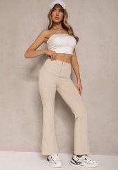 Beżowe Spodnie Dzwony High Waist Odavia. Brązowe spodnie materiałowe damskie Renee, bez wzorów, z jeansu. Za 59.99 zł.