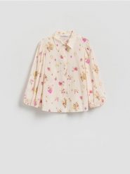 Bawełniana koszula w kwiaty - jasnoniebieski. Niebieskie koszule damskie Reserved, l, bez wzorów, z bawełny, bez kołnierzyka, bez ramiączek. Za 129.99 zł.