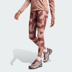 Legginsy Terrex Multi Printed. Brązowe legginsy damskie Adidas, uniwersalny, bez wzorów, z materiału. W wyprzedaży za 244.30 zł.