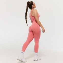Legginsy damskie fitness bezszwowe z wysokim stanem koralowe FLO. Czerwone legginsy damskie GYMBEAM, s, bez wzorów, z elastanu. Za 110.90 zł.