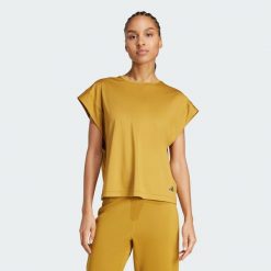 Koszulka Yoga. Brązowe bluzki damskie Adidas, s, bez wzorów, z materiału, bez kołnierzyka, bez ramiączek. W wyprzedaży za 95.40 zł.