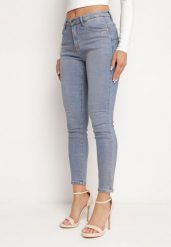 Jasnoniebieskie Jeansy Skinny z Bawełny Ozdobione Złotą Farbą Taidda. Niebieskie jeansy damskie Born2be, z aplikacjami, z bawełny. Za 129.99 zł.