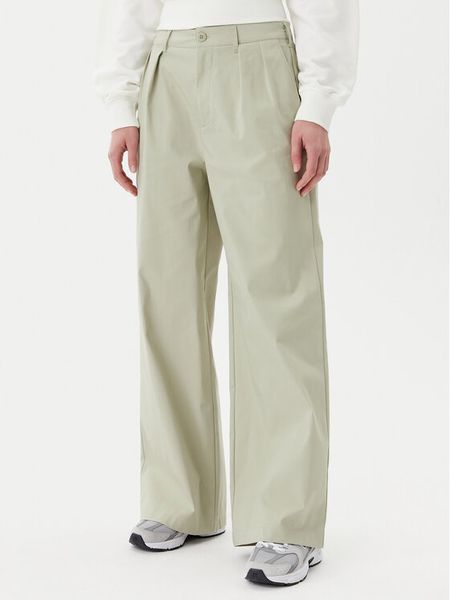 New Balance Spodnie materiałowe Boylston WP51538 Zielony Relaxed Fit. Zielone spodnie materiałowe damskie New Balance, bez wzorów, z bawełny. Za 219.99 zł.