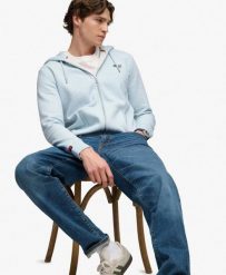 Superdry Bluza z kapturem Essential Logo z połowicznym szczotkowaniem i zamkiem. Niebieskie bluzy damskie Superdry, xl, bez wzorów, z kapturem. Za 380.40 zł.