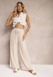 Jasnobeżowe Spodnie z Bawełny Typu Palazzo High Waist z Gumką w Talii Nelsaria. Brązowe spodnie materiałowe damskie Renee, bez wzorów, z bawełny. Za 14.99 zł.