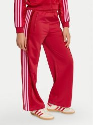 Adidas Spodnie dresowe Adibreak KQ8891 Czerwony Loose Fit. Czerwone spodnie dresowe dziewczęce Adidas, bez wzorów, z dresówki. Za 199.99 zł.