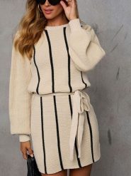 Milan Kiss Sukienka w kolorze beżowym rozmiar: M. Brązowe sukienki damskie Milan Kiss, bez wzorów, bez ramiączek. Za 208.83 zł.