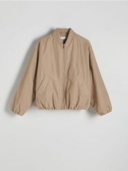 Kurtka bomberka oversize - beżowy. Brązowe kurtki damskie Reserved, l, bez wzorów, z tkaniny, bez kaptura. W wyprzedaży za 159.99 zł.