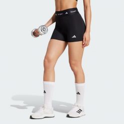 Legginsy TECHFIT Stay In Play Short. Czarne legginsy damskie Adidas, bez wzorów, z materiału. Za 199.00 zł.