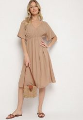 Ciemnobeżowa Bawełniana Sukienka o Rozkloszowanym Fasonie Liranelle. Brązowe sukienki damskie Born2be, bez wzorów, z bawełny, eleganckie, bez ramiączek. W wyprzedaży za 46.74 zł.