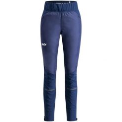Spodnie narciarskie dla kobiet Swix Dynamic Hybrid. Niebieskie spodnie sportowe damskie Swix, na zimę, l, bez wzorów, z materiału, z podwyższonym stanem, na fitness i siłownię, Primaloft. Za 897.15 zł.