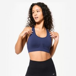 Stanik sportowy Kimjaly. Białe biustonosze sportowe damskie DOMYOS, bez wzorów, z materiału. Za 79.99 zł.