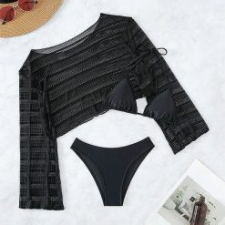 Komplet plażowy z ażurową narzutką i bikini na lato Tressa. Czarne bikini Intica, w ażurowe wzory. W wyprzedaży za 169.00 zł.