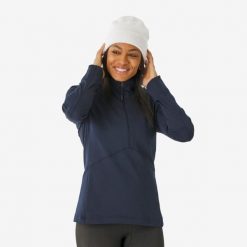 Koszulka termoaktywna narciarska damska Quechua BL 500 1/2 Zip. Niebieskie koszulki damskie WED'ZE, l, bez wzorów, z elastanu, bez kołnierzyka, bez ramiączek. Za 89.99 zł.