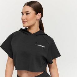 Bluza damska fitness z kapturem Cropped Relay Black. Czarne bluzy damskie GYMBEAM, l, bez wzorów, z materiału, z kapturem. Za 128.90 zł.