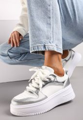 Biało-Srebrne Sznurowane Sneakersy na Platformie z Metalicznymi Wstawkami Arileva. Białe obuwie sportowe damskie Renee, z jeansu, bez zapięcia. Za 79.99 zł.