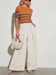 Milan Kiss Spodnie w kolorze kremowym rozmiar: S. Brązowe spodnie materiałowe damskie Milan Kiss, bez wzorów, z materiału. Za 178.95 zł.