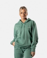Damska bluza z kapturem 365 oversize z kieszenią kangurką – ciemnozielony. Zielone bluzy damskie AESTHETIC WOLF, s, bez wzorów, z bawełny, z kapturem. Za 159.99 zł.
