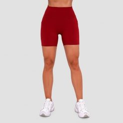 Szorty damskie fitness slim z kieszeniami czerwone Ignite. Czerwone spodenki sportowe damskie GYMBEAM, m, bez wzorów, z elastanu, na fitness i siłownię. Za 85.90 zł.