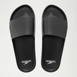 Klapki basenowe antypoślizgowe damskie Speedo Slide Entry. Czarne klapki damskie Speedo, bez wzorów, z materiału, bez obcasa, bez zapięcia. Za 63.99 zł.
