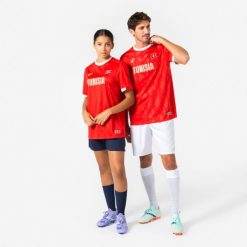 Koszulka piłkarska dla kibiców Tunezja 2026. Czerwone bluzki damskie KIPSTA, s, bez wzorów, z materiału, sportowe, bez kołnierzyka, bez ramiączek. Za 44.99 zł.