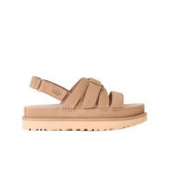 Damskie sandały Ugg W Goldenstar Gleam 1175122-MDS. Brązowe sandały damskie Ugg, bez wzorów, z materiału, z okrągłym noskiem, bez obcasa, bez zapięcia. Za 568.90 zł.