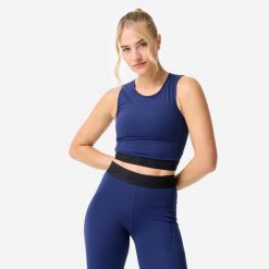 Koszulka fitness damska Domyos crop top. Niebieskie koszulki sportowe damskie DOMYOS, l, bez wzorów, z elastanu, bez ramiączek, na fitness i siłownię. Za 69.99 zł.
