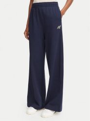 Lacoste Spodnie dresowe XF8392 Granatowy Flare Fit. Niebieskie spodnie dresowe damskie Lacoste, bez wzorów, z bawełny. Za 579.99 zł.