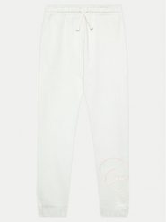 Guess Spodnie dresowe J4YQ16 KA6R3 Biały Relaxed Fit. Białe spodnie dresowe dziewczęce Guess, z aplikacjami, z bawełny. Za 99.99 zł.