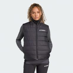 Ocieplana kamizelka Terrex Multi Essentials CLIMAWARM. Czarne kamizelki damskie Adidas, s, bez wzorów, bez kaptura. Za 349.00 zł.