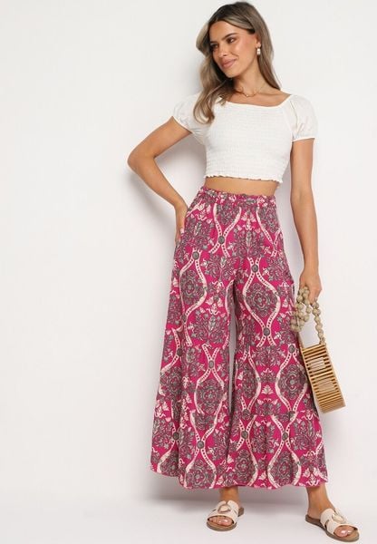 Fuksjowe Szerokie Wiskozowe Spodnie z Wysokim Stanem i Gumką w Talii Risettesna. Czerwone spodnie materiałowe damskie Born2be, bez wzorów, z jeansu. Za 59.99 zł.