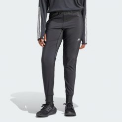 Spodnie Own the Run. Czarne obuwie sportowe damskie Adidas, z materiału, bez zapięcia, do biegania. Za 259.00 zł.