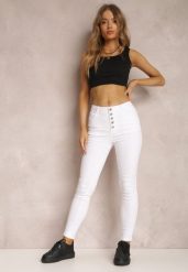 Białe Spodnie Skinny Winvienne. Białe rurki damskie Renee, w ażurowe wzory, z jeansu, z podwyższonym stanem. Za 49.99 zł.