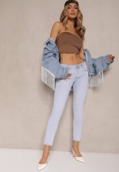 Jasnoniebieskie Jeansy o Kroju Skinny Low Waist Kolanilia. Niebieskie jeansy damskie Renee, bez wzorów, z jeansu, z obniżonym stanem. Za 99.99 zł.