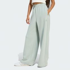 SPODNIE SOFT LUX STRAIGHT LEG. Niebieskie spodnie sportowe damskie Adidas, m, bez wzorów, z bawełny, na fitness i siłownię. Za 209.30 zł.
