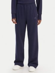 DKNY Sport Spodnie dresowe DP6P3795 Granatowy Regular Fit. Niebieskie spodnie dresowe damskie DKNY Sport, m, bez wzorów, z bawełny. Za 309.99 zł.