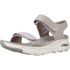 Sandały SKECHERS ARCH FIT TOURISTY Beżowy. Brązowe sandały damskie Skechers, bez wzorów, z tkaniny, bez obcasa, bez zapięcia. Za 312.99 zł.