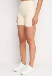 Jasnobeżowe Szorty Kolarki przed Kolano w Sportowym Stylu z Efektem Push Up Vesna. Brązowe spodenki sportowe damskie Born2be, m, z aplikacjami. Za 39.99 zł.
