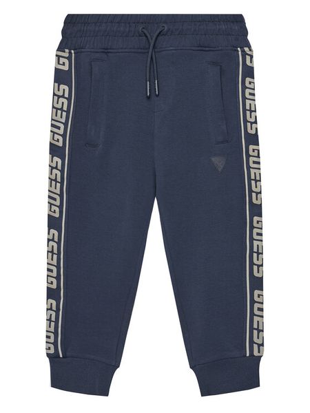 Guess Spodnie dresowe L2YQ48 K6ZS1 Granatowy Regular Fit. Niebieskie spodnie dresowe chłopięce Guess, z bawełny. Za 179.99 zł.