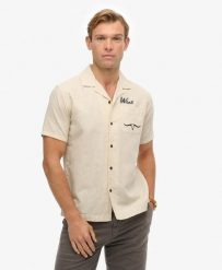 Superdry Koszula Resort The Merchant Store z bawełny i lnu – Oatmeal Beige. Brązowe koszule damskie Superdry, l, bez wzorów, z bawełny, bez kołnierzyka, bez ramiączek. Za 280.80 zł.