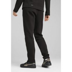 Damskie spodnie dresowe EVOSTRIPE PUMA Black. Czarne spodnie dresowe damskie Puma, xl, bez wzorów, z dresówki. W wyprzedaży za 129.00 zł.