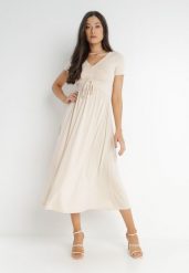 Jasnobeżowa Sukienka Ionene. Brązowe sukienki damskie Born2be, bez wzorów, bez ramiączek. Za 169.99 zł.