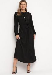 Czarna Rozkloszowana Sukienka Maxi z Plisowanym Dołem i Wiązanym Paskiem Nollira. Czarne sukienki damskie Born2be, bez wzorów, eleganckie, bez ramiączek. W wyprzedaży za 110.49 zł.