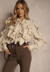 Beżowa Koszula z Wiskozą Zdobiona Falbanami i Wiązaniem przy Szyi Ravissa. Brązowe koszule damskie Renee, na lato, m, z aplikacjami, z wiskozy, eleganckie, bez kołnierzyka, bez ramiączek. Za 159.99 zł.