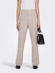 ONLY Spodnie "Raven" w kolorze beżowym rozmiar: 34/L32. Brązowe spodnie materiałowe damskie Only, bez wzorów, z materiału. Za 104.99 zł.