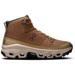 Buty damskie On Cloudrock Mid Waterproof. Brązowe obuwie trekkingowe damskie On, z gumy, przed kolano, bez zapięcia. Za 879.99 zł.