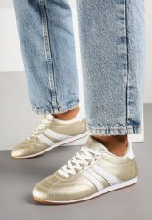 Złoto-Białe Sznurowane Sneakersy w Stylu Tenisówek Liavessa. Żółte obuwie sportowe damskie Born2be, z jeansu, bez zapięcia, tenisowe. Za 84.99 zł.