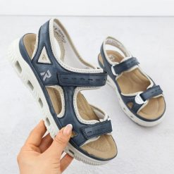 Sandały damskie sportowe na rzep granatowe Rieker 64066-14. Sandały damskie Rieker, bez wzorów, ze skóry ekologicznej, bez obcasa, bez zapięcia. Za 288.99 zł.